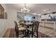 Dining room has a view of the kitchen, stairs, and living room, creating a spacious and connected living space at 213 Hickory Bluffs Pkwy, Canton, GA 30114