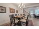 Formal dining room featuring a modern chandelier, dining table, and rug at 213 Hickory Bluffs Pkwy, Canton, GA 30114