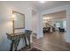Open foyer with wood floors, decorative table, and view into the dining and living areas at 213 Hickory Bluffs Pkwy, Canton, GA 30114