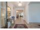 Welcoming foyer featuring hardwood floors, an ornate console table, and open access to living spaces at 213 Hickory Bluffs Pkwy, Canton, GA 30114