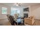 Comfortable living room with a fireplace, a large window, and seating for relaxing or entertaining at 213 Hickory Bluffs Pkwy, Canton, GA 30114