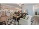 Spacious living room seamlessly flows into dining area and kitchen, perfect for entertaining and Gathering gatherings at 213 Hickory Bluffs Pkwy, Canton, GA 30114