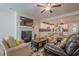 Open concept living room and kitchen with a fireplace, comfortable seating, and stainless steel appliances at 213 Hickory Bluffs Pkwy, Canton, GA 30114