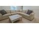Comfortable living room features an oversized sectional sofa, neutral carpet, and stylish throw pillows at 213 Hickory Bluffs Pkwy, Canton, GA 30114