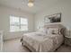 Bedroom features large window, neutral paint, soft carpet, and ceiling fan at 213 Hickory Bluffs Pkwy, Canton, GA 30114