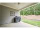 Covered patio with view of private backyard and lush landscaping; great for outdoor entertaining at 213 Hickory Bluffs Pkwy, Canton, GA 30114