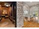 Brick lined walls leading to a basement wine cellar with brick flooring at 2211 Lattimore Farm Nw Dr, Kennesaw, GA 30152