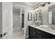 Modern bathroom featuring double sinks, gold hardware, and a walk-in shower at 2211 Lattimore Farm Nw Dr, Kennesaw, GA 30152