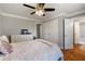 Bedroom featuring hardwood floors, closet, and an open bathroom at 2211 Lattimore Farm Nw Dr, Kennesaw, GA 30152