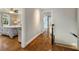 Hallway leading to a bedroom with hardwood floors and neutral wall paint at 2211 Lattimore Farm Nw Dr, Kennesaw, GA 30152