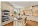 Well-appointed kitchen with stainless steel appliances, granite countertops, and custom cabinetry with island at 2211 Lattimore Farm Nw Dr, Kennesaw, GA 30152