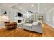 Living room with hardwood floors, fire place, and a ceiling fan at 2211 Lattimore Farm Nw Dr, Kennesaw, GA 30152