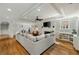 This living room boasts a decorative tray ceiling, wainscoting, and a stylish fireplace at 2211 Lattimore Farm Nw Dr, Kennesaw, GA 30152