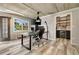 Bright home office featuring hardwood floors, a pantry and built-in shelving at 2211 Lattimore Farm Nw Dr, Kennesaw, GA 30152