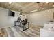 Modern home office with concrete ceiling, a stone accent wall and bright lighting at 2211 Lattimore Farm Nw Dr, Kennesaw, GA 30152