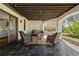 Relaxing outdoor patio featuring stone flooring, comfortable seating, and string lights at 2211 Lattimore Farm Nw Dr, Kennesaw, GA 30152