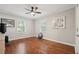Neutral bedroom with hardwood floors, ceiling fan, and ample natural light at 2586 Valley Stream Dr, Atlanta, GA 30360