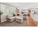 Bright living room featuring stylish decor, hardwood floors, and lots of natural light at 2586 Valley Stream Dr, Atlanta, GA 30360