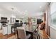 Open-concept living space with dining area and updated kitchen at 2586 Valley Stream Dr, Atlanta, GA 30360