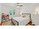 Charming bedroom with black metal bed frame, bright natural light, and stylish decor at 261 Demetra Se Dr, Mableton, GA 30126