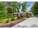 Well-maintained brick house with spacious driveway and landscaped front yard at 261 Demetra Se Dr, Mableton, GA 30126