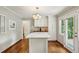 Bright eat-in kitchen featuring a stylish island, hardwood floors, and plenty of storage at 261 Demetra Se Dr, Mableton, GA 30126