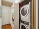 Convenient laundry room area with a stacked washer and dryer at 261 Demetra Se Dr, Mableton, GA 30126