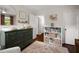 Bedroom with a green changing table, cream colored rug, and closet at 283 Norton Se Cir, Smyrna, GA 30082