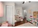 Playroom featuring pink armchair, hardwood floors and an organized toy storage unit at 283 Norton Se Cir, Smyrna, GA 30082