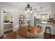 Dining area with hardwood floors located next to the kitchen and living areas at 283 Norton Se Cir, Smyrna, GA 30082