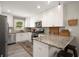 Modern kitchen featuring granite countertops, stainless steel appliances, and ample cabinet space at 283 Norton Se Cir, Smyrna, GA 30082
