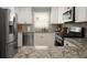 Updated kitchen with granite countertops, stainless steel appliances, and white cabinets at 283 Norton Se Cir, Smyrna, GA 30082
