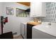 Laundry room features modern washer, dryer, and plenty of storage space at 283 Norton Se Cir, Smyrna, GA 30082