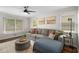 Comfortable living room featuring hardwood floors, a stylish sofa, and plenty of natural light at 283 Norton Se Cir, Smyrna, GA 30082