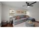Cozy living room with hardwood floors, a comfortable sofa, and ample natural light at 283 Norton Se Cir, Smyrna, GA 30082