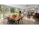 Spacious sunroom/living room and dining area are filled with natural light from numerous windows at 283 Norton Se Cir, Smyrna, GA 30082