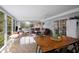 Bright sunroom/living room and dining area with walls of windows and a sliding glass door at 283 Norton Se Cir, Smyrna, GA 30082