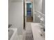 Bright bathroom with white tile, updated vanity, and plenty of natural light at 4246 Chestnut Grove Ln, Austell, GA 30106