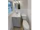 This full bathroom features white tile, updated vanity, toilet and fixtures at 4246 Chestnut Grove Ln, Austell, GA 30106