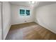 Bright and airy bedroom with neutral carpet flooring and a large window at 4246 Chestnut Grove Ln, Austell, GA 30106