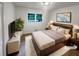 Virtually staged bedroom featuring a modern bedframe, contemporary decor, and soft lighting at 4246 Chestnut Grove Ln, Austell, GA 30106
