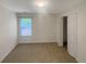 Clean and bright bedroom with carpet and natural light at 4246 Chestnut Grove Ln, Austell, GA 30106