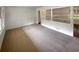 Bright living room with carpet flooring, a view into the kitchen, and plenty of natural light at 4246 Chestnut Grove Ln, Austell, GA 30106