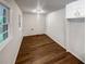 Room with hardwood floors, freshly painted walls, and a rear entry/exit door at 4246 Chestnut Grove Ln, Austell, GA 30106