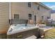 Back patio with a hot tub, table and chairs and a grill at 6252 Selborn Sw Dr, Atlanta, GA 30331
