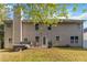 Back of house showing siding, multiple windows, patio, hot tub, grill and lawn at 6252 Selborn Sw Dr, Atlanta, GA 30331