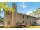 Back of house showing siding, multiple windows, patio, hot tub, grill and lawn at 6252 Selborn Sw Dr, Atlanta, GA 30331