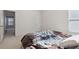 Bright bedroom with a patterned comforter on the bed and two large windows with blinds at 6252 Selborn Sw Dr, Atlanta, GA 30331