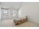 Bright bedroom with a vaulted ceiling, natural light, and a floral quilt on the bed at 6252 Selborn Sw Dr, Atlanta, GA 30331