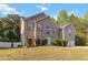 Traditional home with brick facade, shuttered windows, and a well-kept lawn surrounded by mature trees at 6252 Selborn Sw Dr, Atlanta, GA 30331
